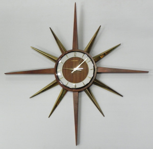 Lot 179 - Mid-century Junghams brass and teak Starburst wall clock - 64cm H