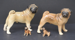 Lot 202 - 4 x Ceramic Pug Dog figures - Made in England - 2 x Standing and two