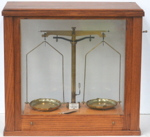 Lot 084 - 1950s glass cased W & J George & Becker Ltd brass balance scal