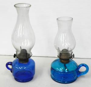 Lot 198 - 2 x Victorian blue glass finger lamps, one with embossed stars (taller