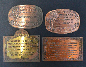 Lot 031 - 4 x reproduction brass and copper embossed comical plaques (widest 12