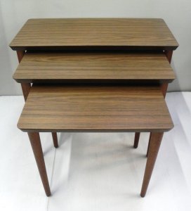 Lot 003 - Nest of 3 1970s tables with tapering legs and brown laminate finish