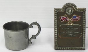 Lot 173 - Oak mounted enamelled brass plaque commemorating British Empire vs USA