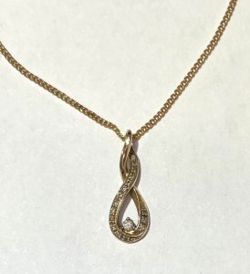 Lot 158 - 9ct gold diamond set pendant (approx 0 9grms) on plated chain