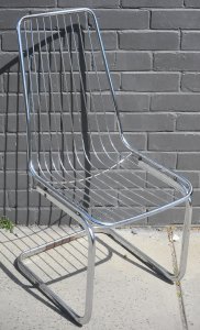 Lot 003 - Modernist chromed cantilevered chair frame (no cushions) - 97cm H