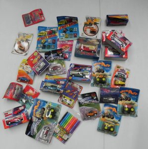 Lot 115 - Box lot of 1980s carded and boxed die-cast vehicles in various scales