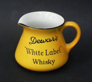 Lot 109 - Vintage Mintons Dewars White Label Whisky Jug - Yellow glaze with blac