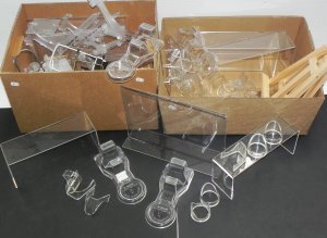Lot 065 - 2 x Boxes Display stands - mostly Perspex inc Trio stands, Plate, Sign